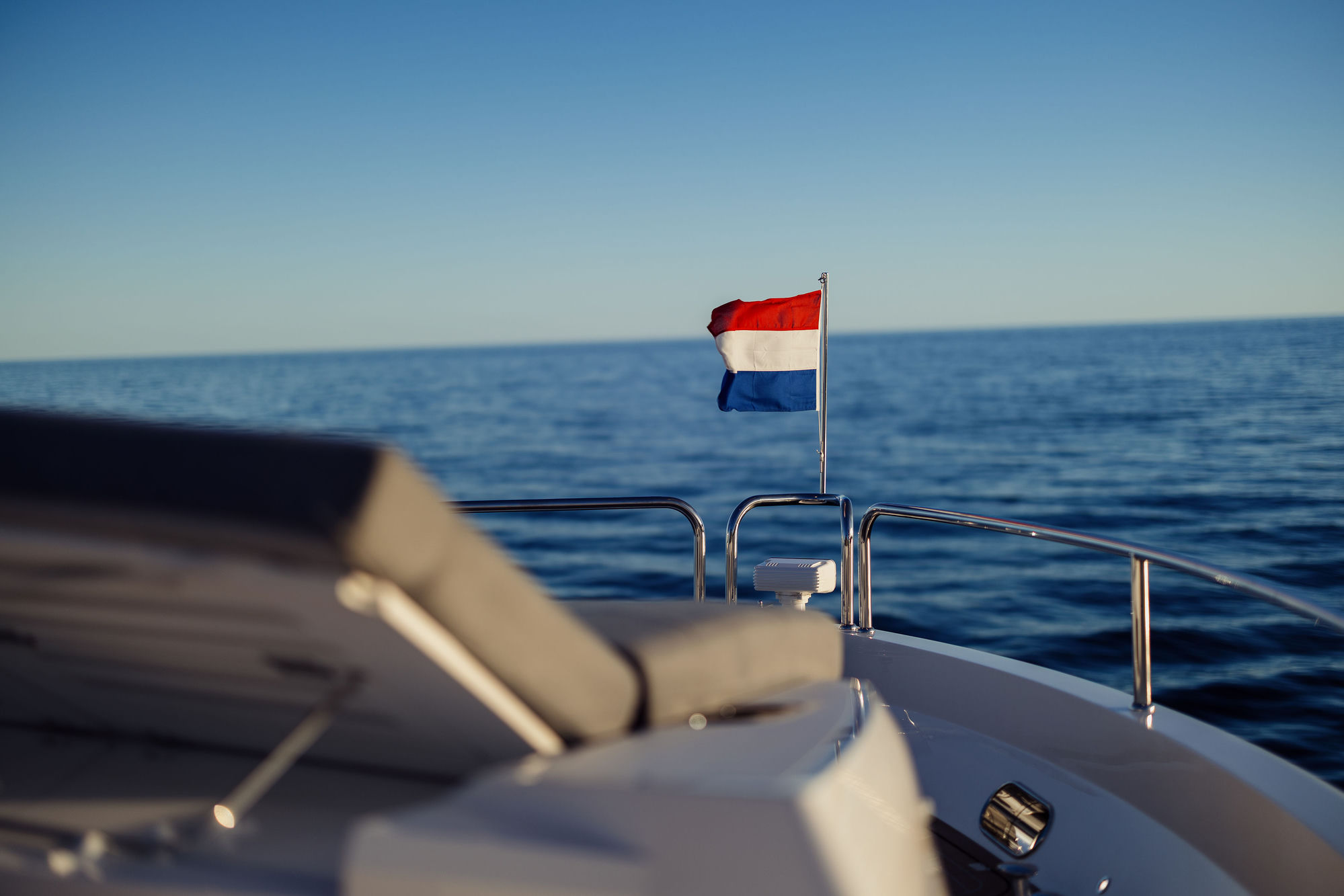 M/Y Lio Black Knight Sunseeker 95 with Dutch flag on bow — luxury charter yacht