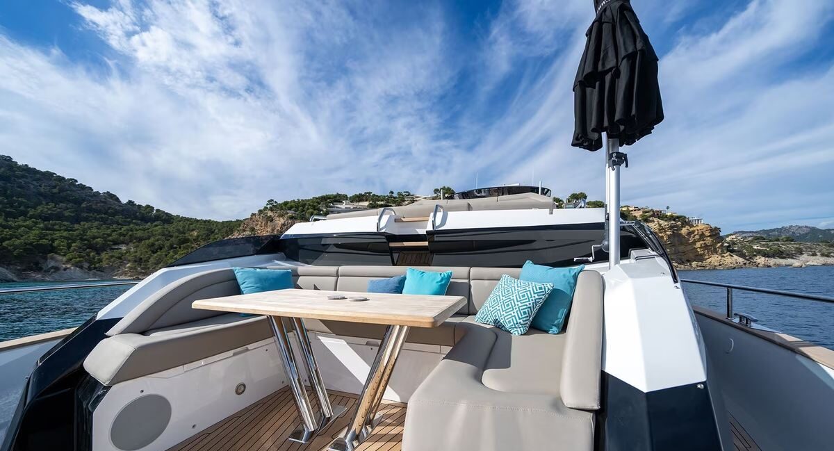 Woman relaxing on flybridge of M/Y Lio Black Knight Sunseeker 95 — luxury charter Balearic Islands