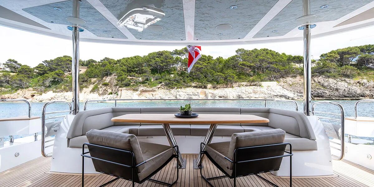 Guests toasting alfresco on aft deck of M/Y Lio Black Knight Sunseeker 95 — luxury charter Palma de Mallorca