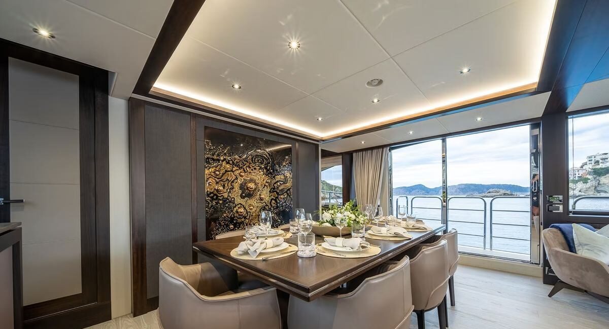 Breakfast table setting at sea aboard M/Y Lio Black Knight Sunseeker 95 — luxury charter dining