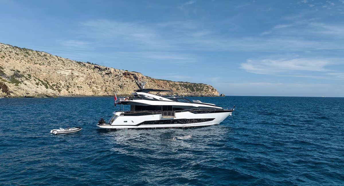 M/Y Lio Black Knight Sunseeker 95 with Dutch flag on bow — luxury charter yacht