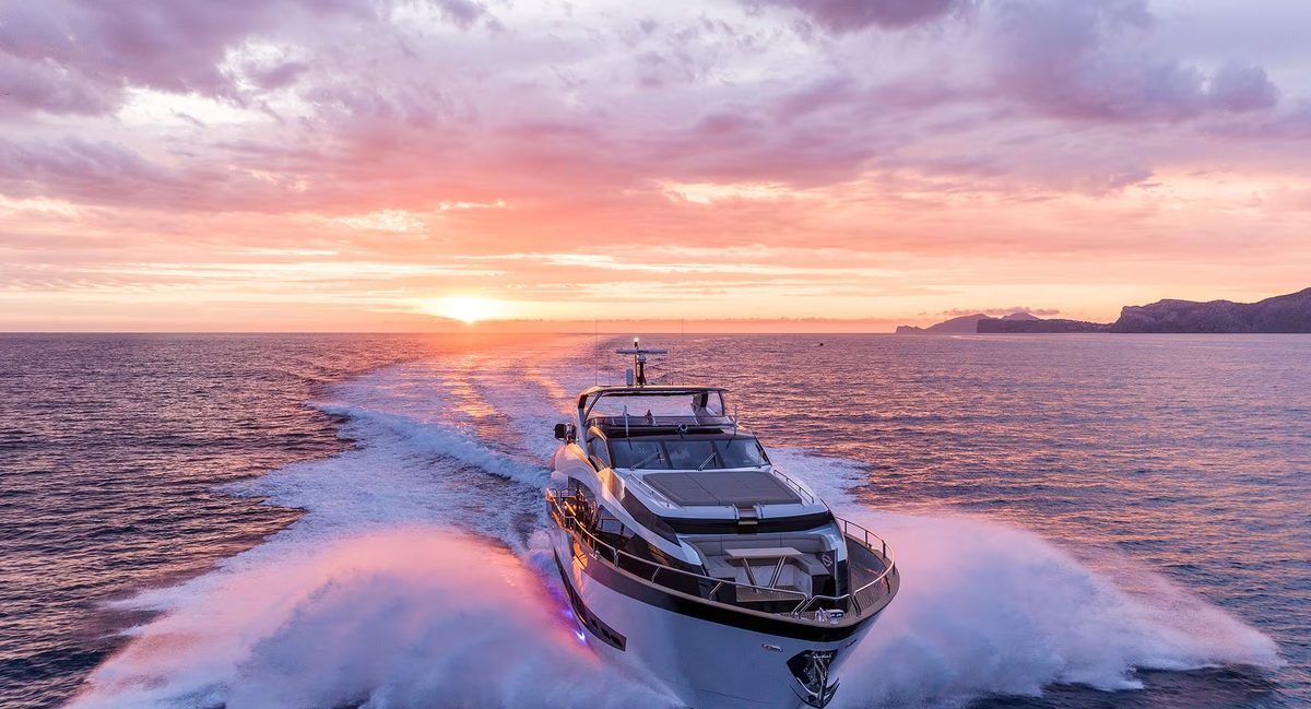 Guest raising wine glass at dinner on M/Y Lio Black Knight Sunseeker 95 — charter dining
