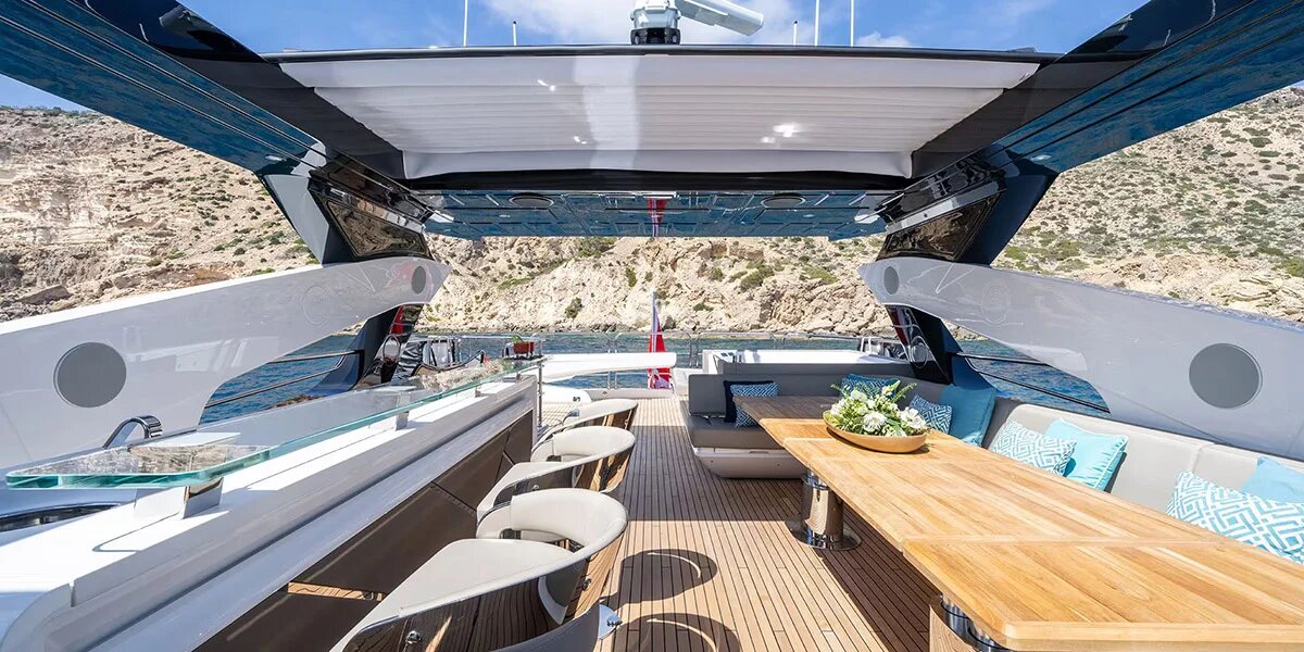 Woman relaxing on flybridge of M/Y Lio Black Knight Sunseeker 95 — luxury charter Balearic Islands