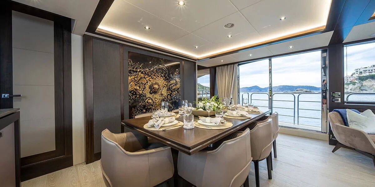 M/Y Lio Black Knight Sunseeker 95 indoor dining area — luxury yacht charter Mallorca